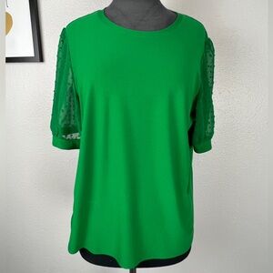 Green blouse with polka dot sheer sleeves